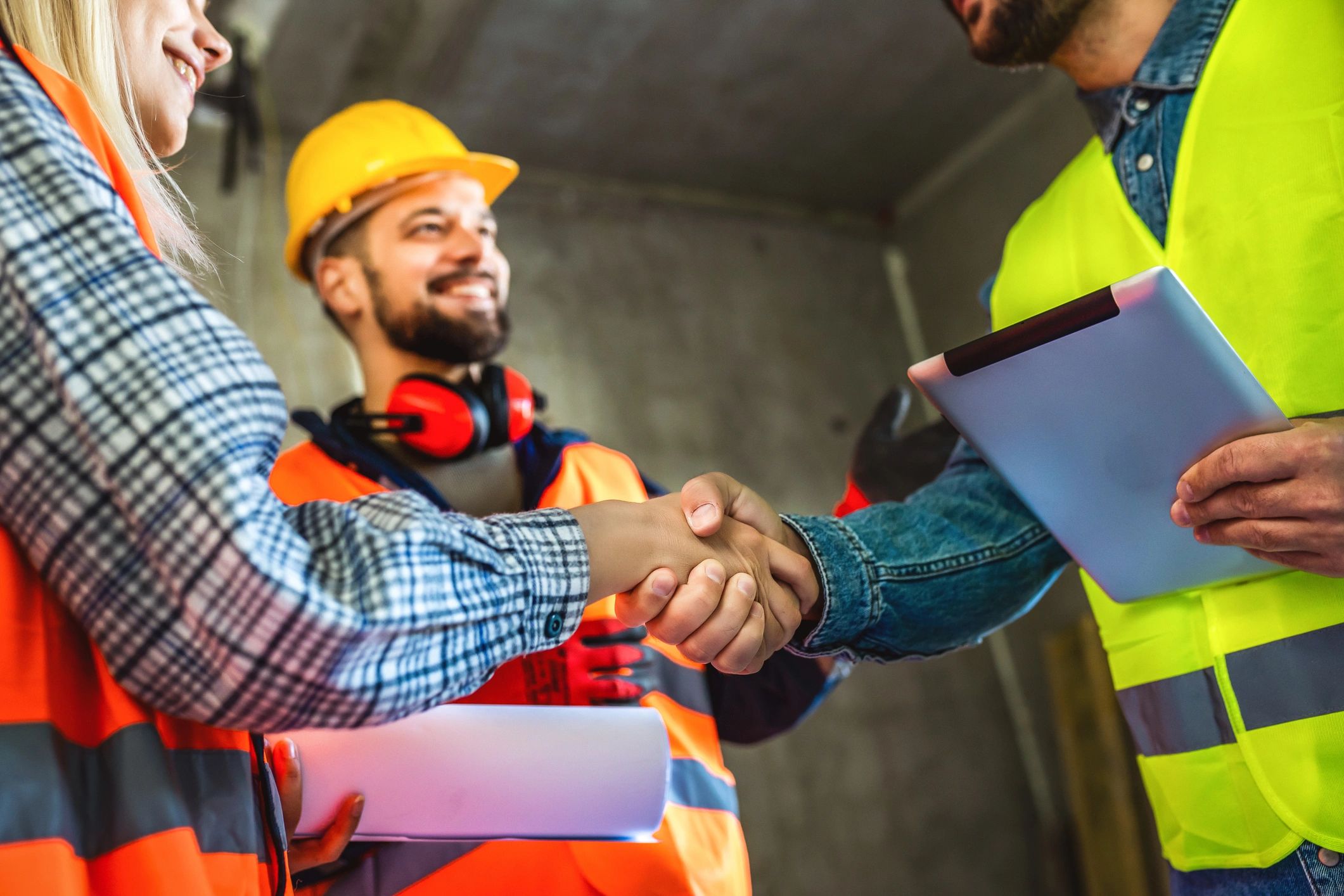 Industrial professionals reviewing project plans