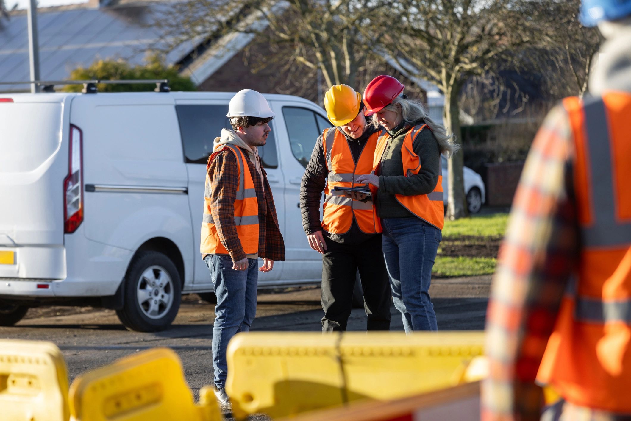 Inspection team discussing work on an industrial site